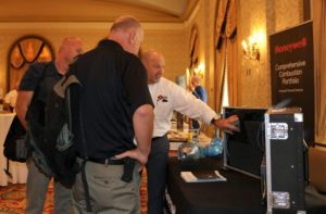 IHEA Fall Seminar attendee takes advantage of visiting with tabletop exhibitors during the networking reception.